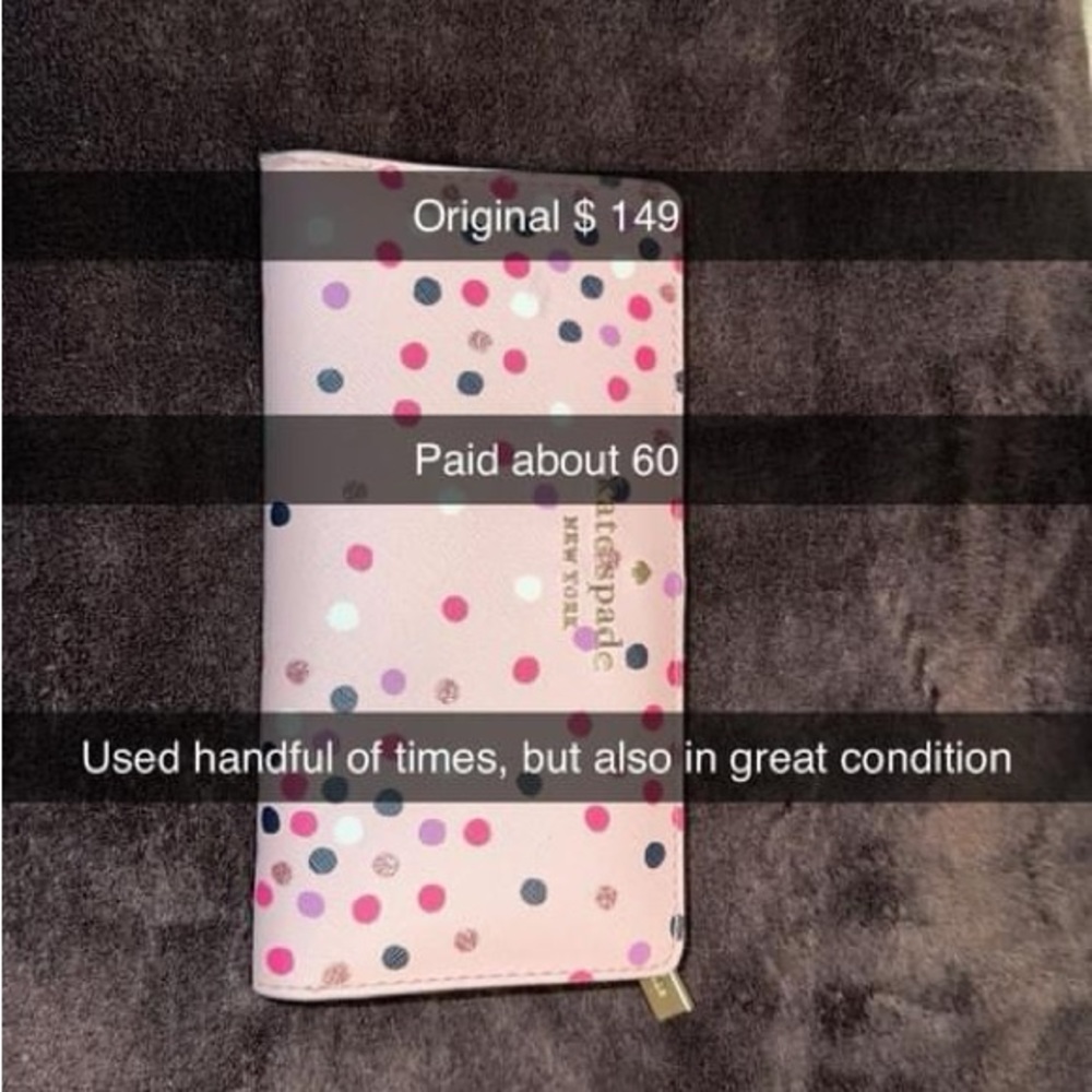Pink and purple polka dotted Kate Spade wallet and phone holder.